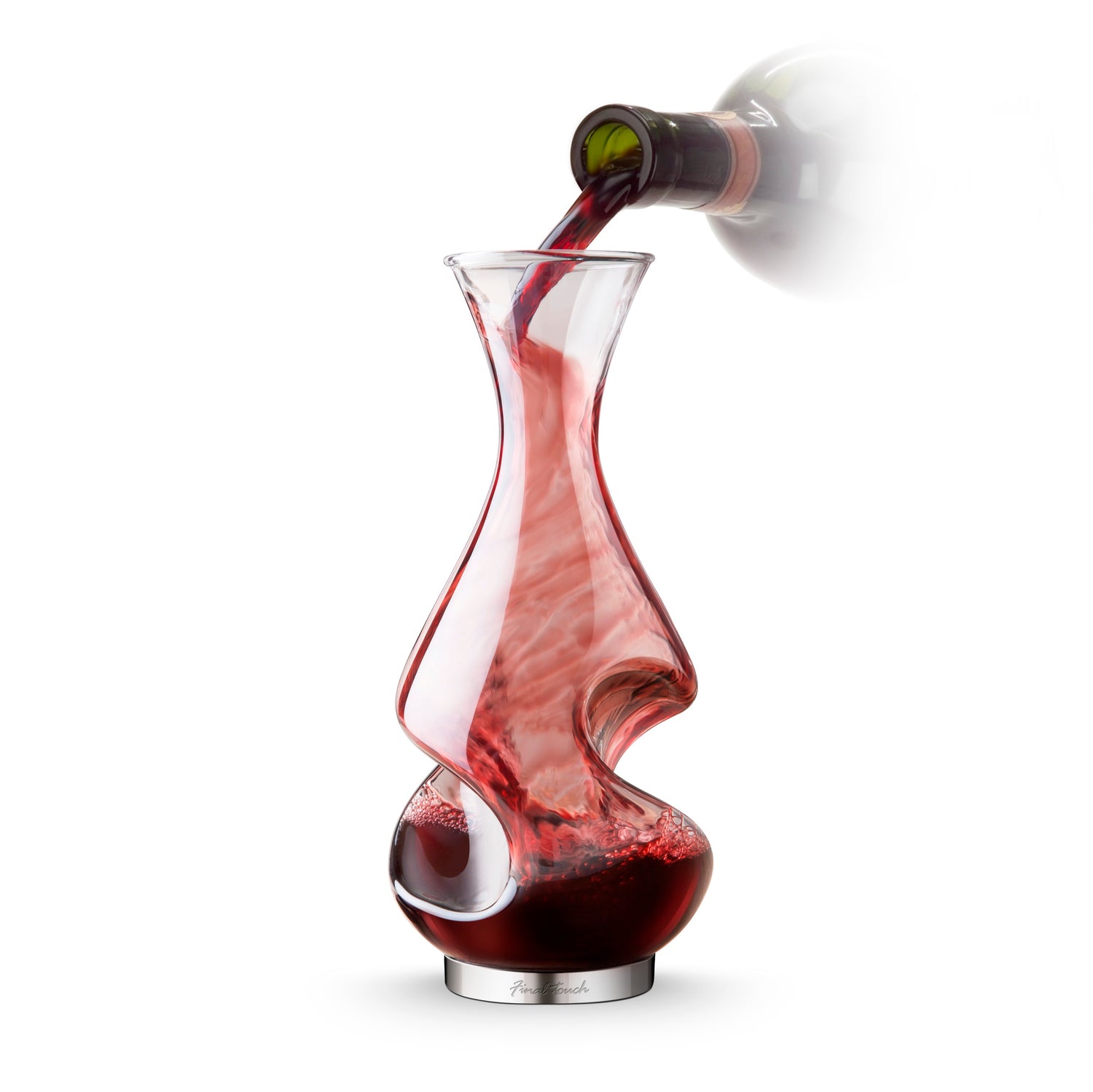 Red wine flows into a sculpted glass decanter with swirling curves and a metallic base.